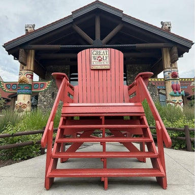 Red 10' Giant Chair in front of a wooden lodge structure with 'Great Wolf Lodge' sign.