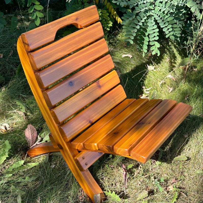 Camp Chair on grass with plants in the background