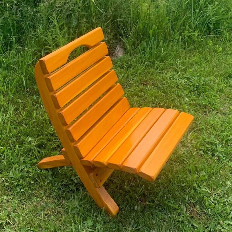 Orange Camp Chair on a grassy background