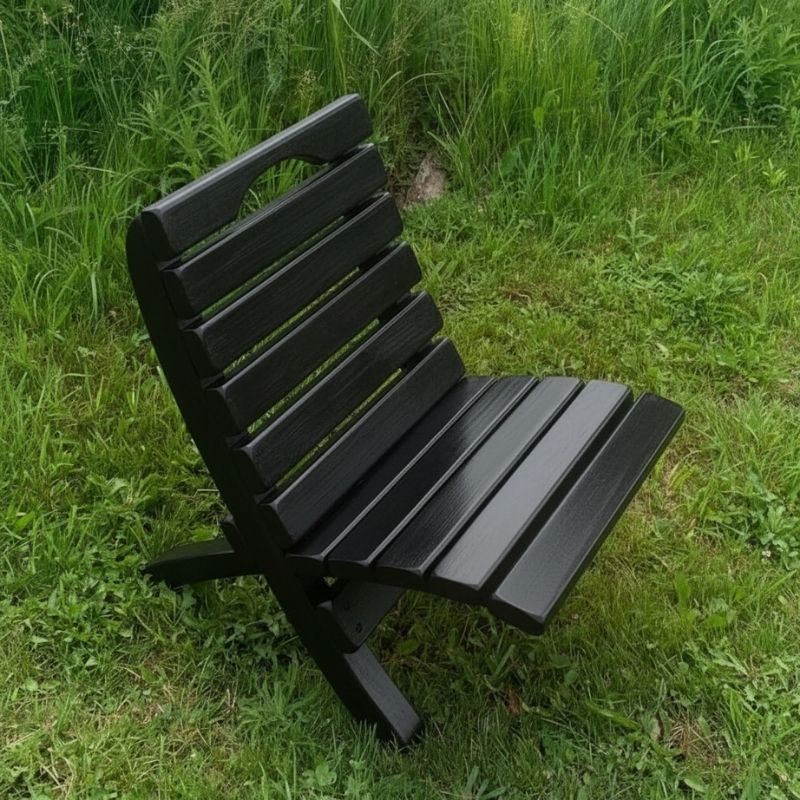 Camp Chair in a grassy outdoor setting - poly luxe - black