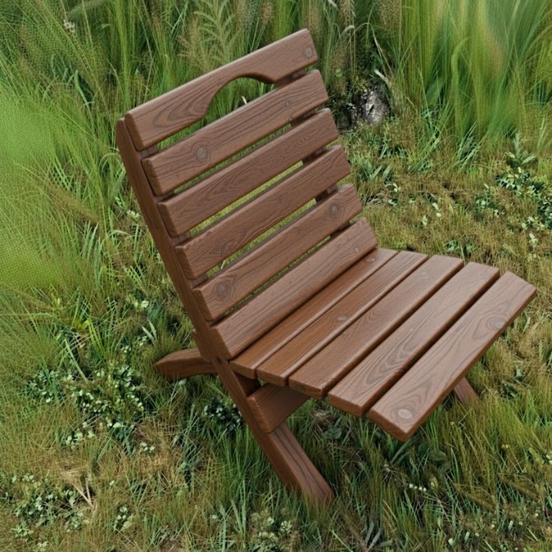 Camp Chair in a grassy outdoor setting - woodgrain brazilian walnut