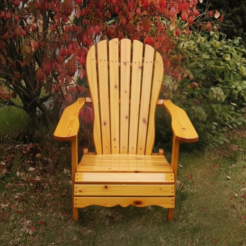 Wooden Adirondack chair on a patio with greenery in the background - sandal back  golden glossy - knotted cedar