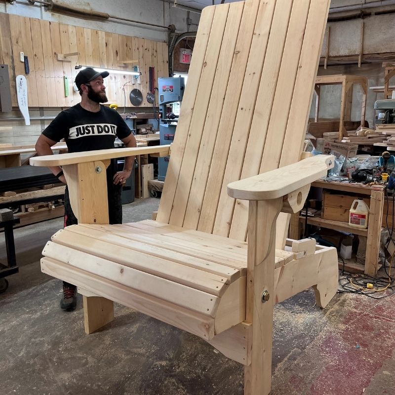 Man starring at Customized Giant in a workshop