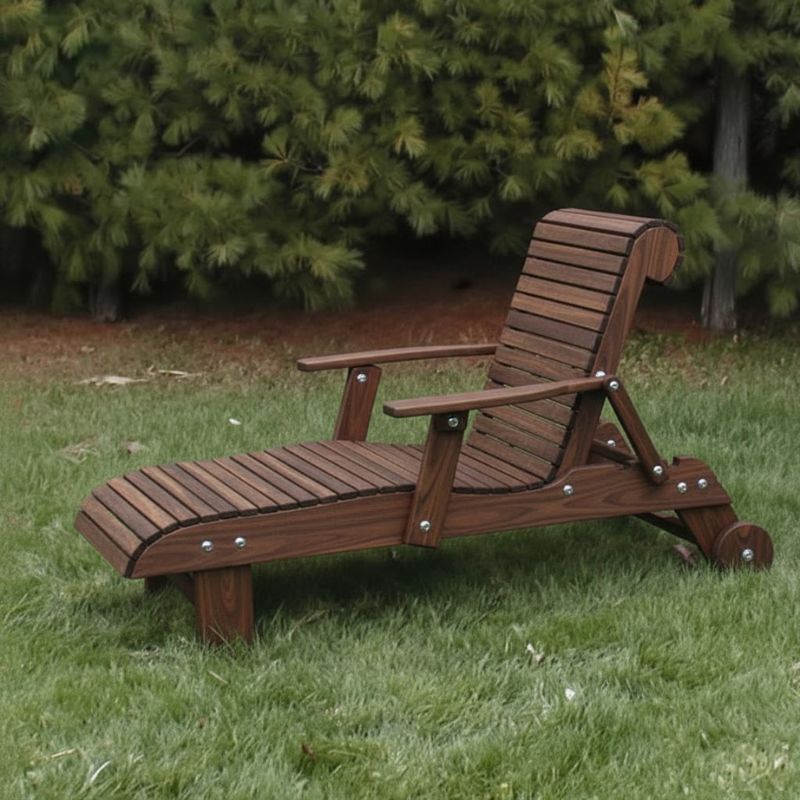 Deluxe Lounge Chair on grass with green bushes in the background - poly luxe - woodgrain brazilian walnut