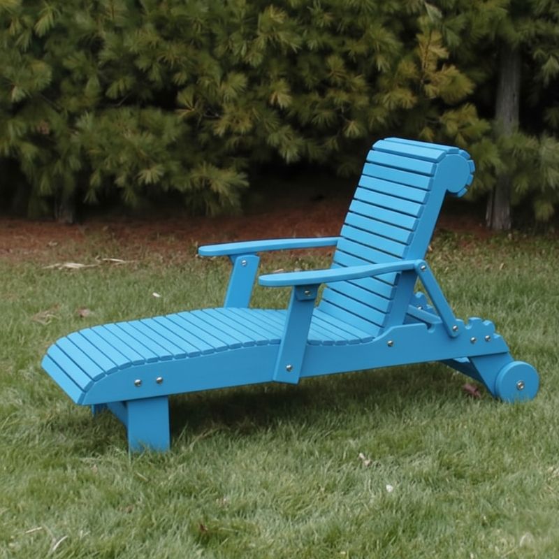 Deluxe Lounge Chair on grass with green bushes in the background - poly luxe - aruba blue