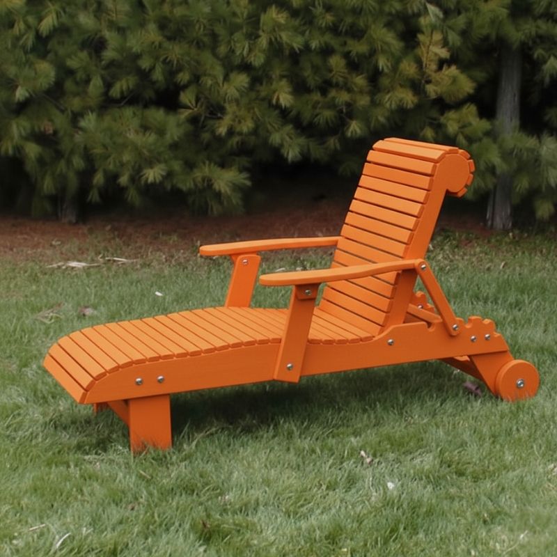 Deluxe Lounge Chair on grass with green bushes in the background - poly luxe - orange