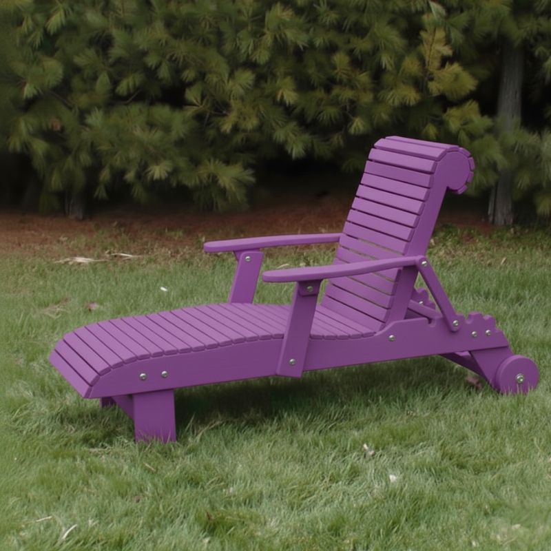 Deluxe Lounge Chair on grass with green bushes in the background - poly luxe - purple