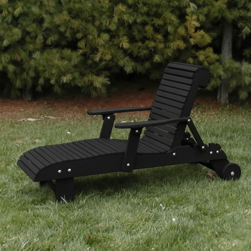 Deluxe Lounge Chair on grass with green bushes in the background - poly luxe - black
