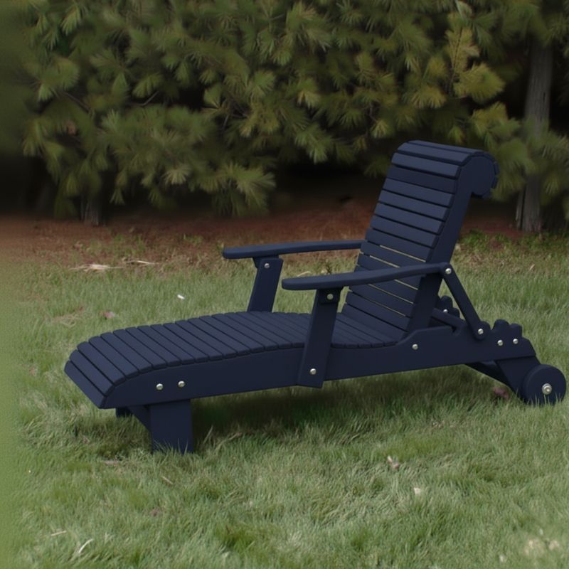 Deluxe Lounge Chair on grass with green bushes in the background - poly luxe - patriot blue