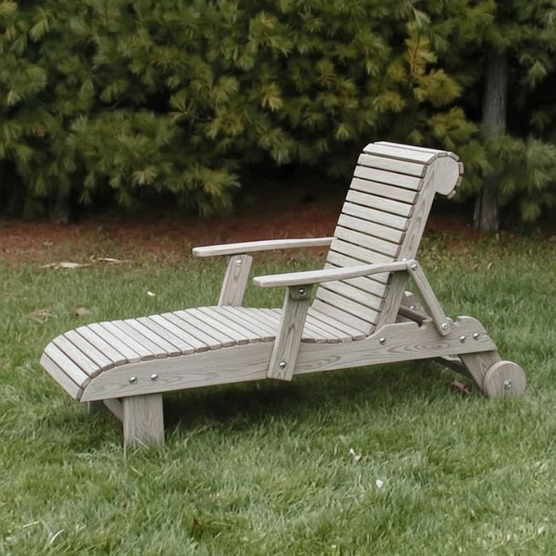 Deluxe Lounge Chair on grass with green bushes in the background - poly luxe - woodgrain driftwood grey
