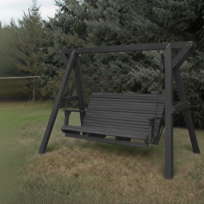 Dark grey Family Porch Swing with Frame set on grass with trees in the background