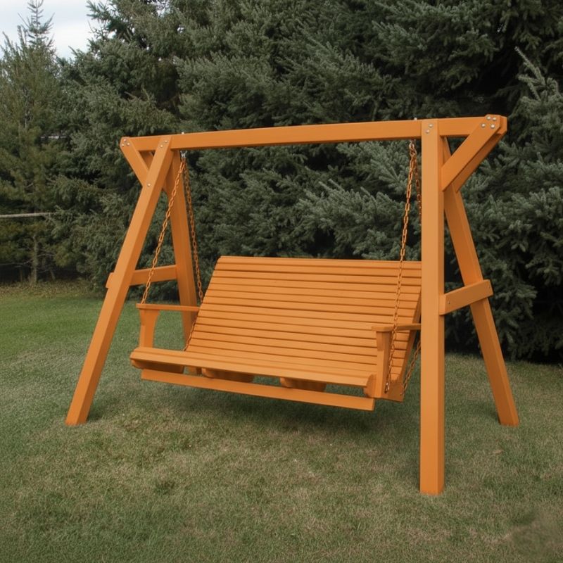 Orange Family Porch Swing with Frame set on grass with trees in the background