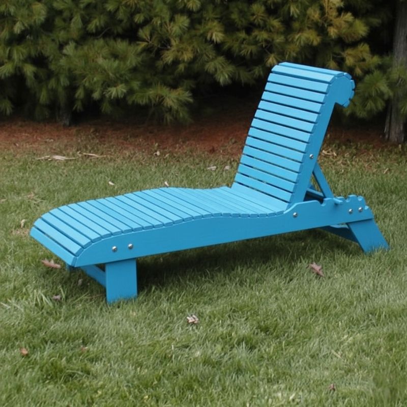 Lounge Chair on grass with trees in the background - poly luxe - aruba blue