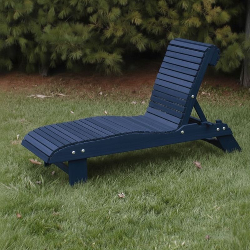 Lounge Chair on grass with trees in the background - poly luxe - patriot blue
