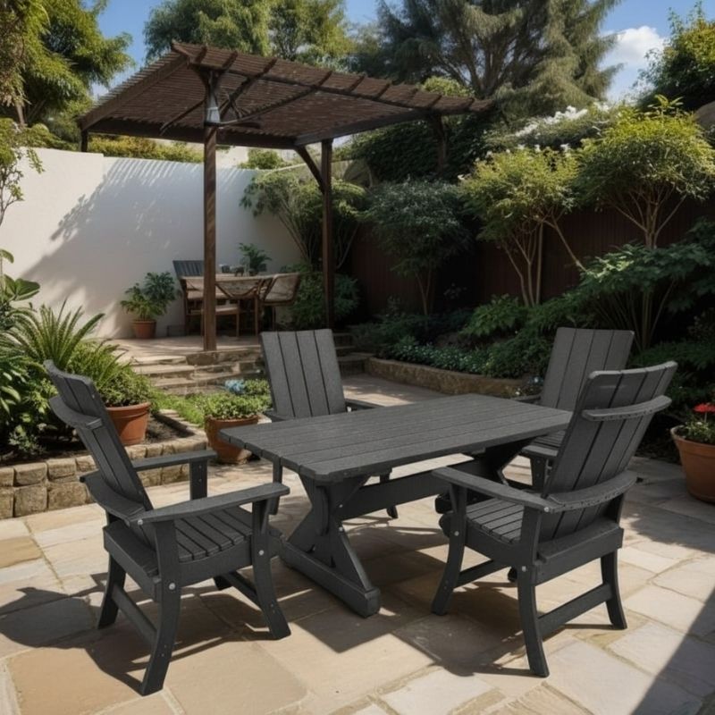 Modern Dining Set for 4 with 4' Table on a patio, surrounded by garden and house - poly luxe - dark grey