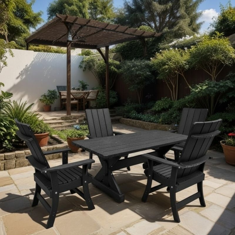 Modern Dining Set for 4 with 4' Table on a patio, surrounded by garden and house - poly luxe - black