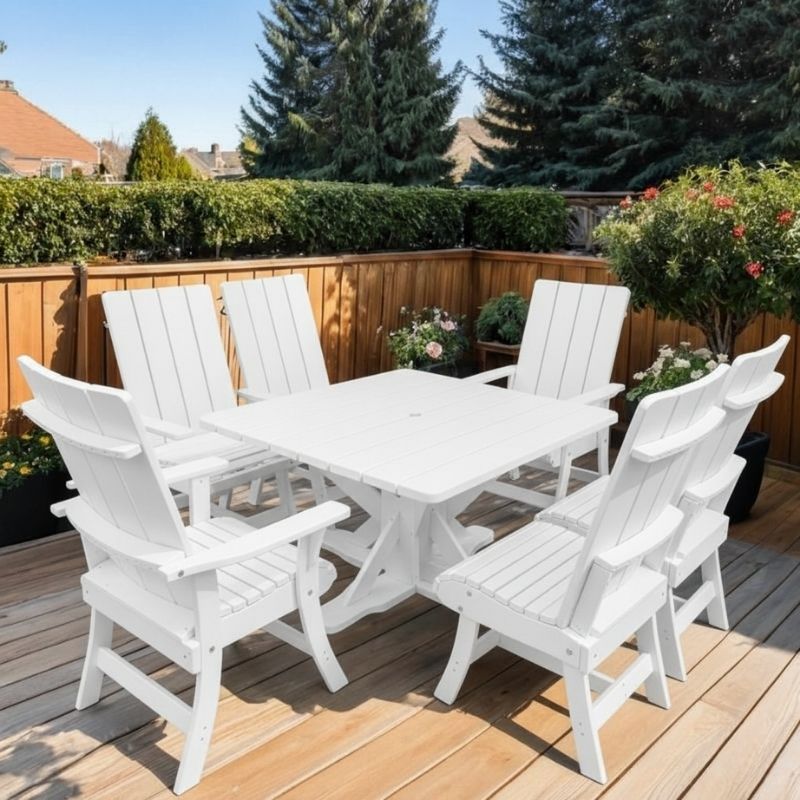 Modern Dining Set for 6 with Pedestal Table on a deck surrounded by greenery - poly luxe - black