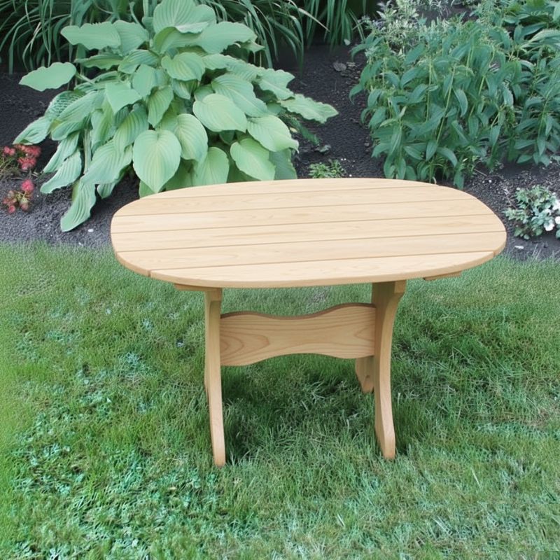 Oval Side Table in a grassy area with plants in the background - poly luxe - woodgrain birchwood