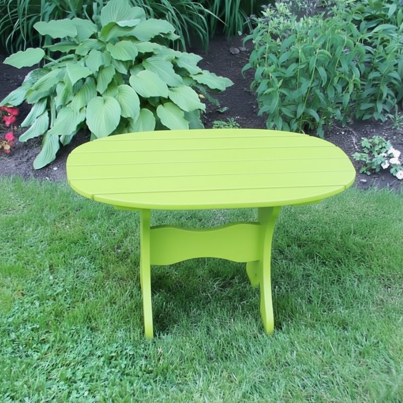 Oval Side Table in a grassy area with plants in the background - poly luxe - lime green
