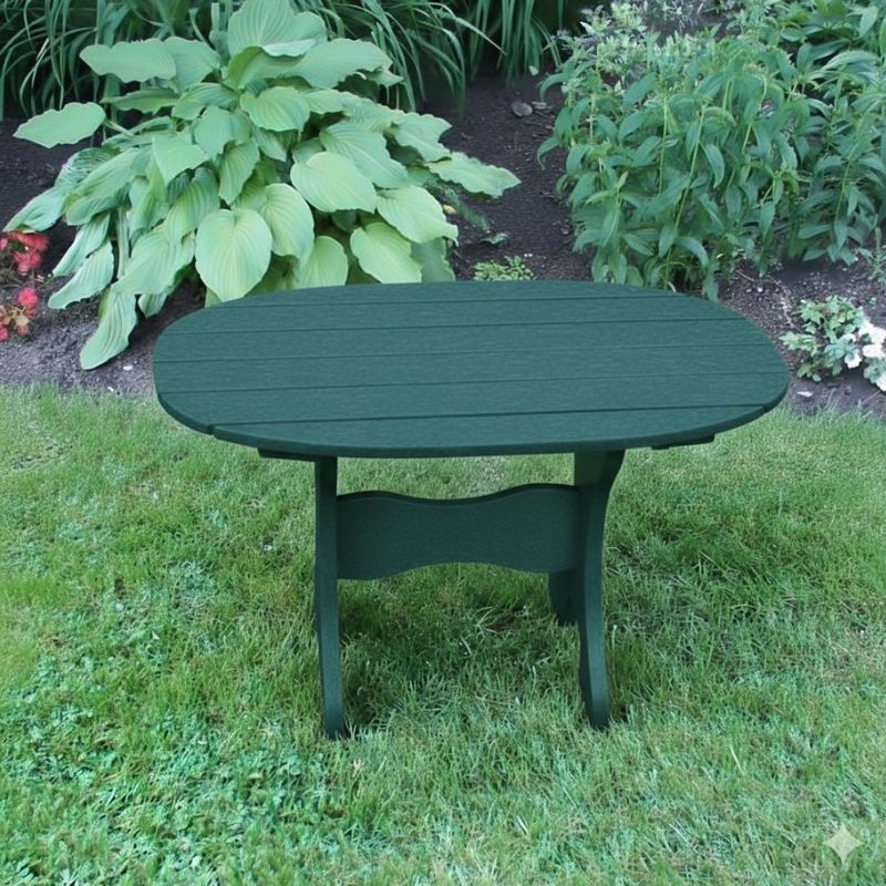 Oval Side Table in a grassy area with plants in the background - poly luxe - turf green
