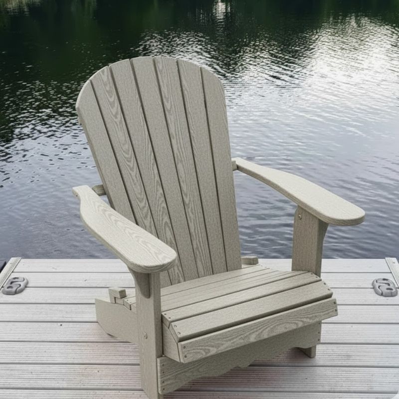 Royal Adirondack Chair (Large) on a dock by a body of water - poly luxe - woodgrain driftwood grey