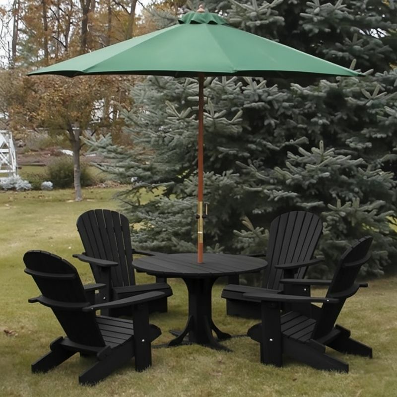 Black Royal Picnic Set for 4 with a green umbrella on a grassy area with trees in the background