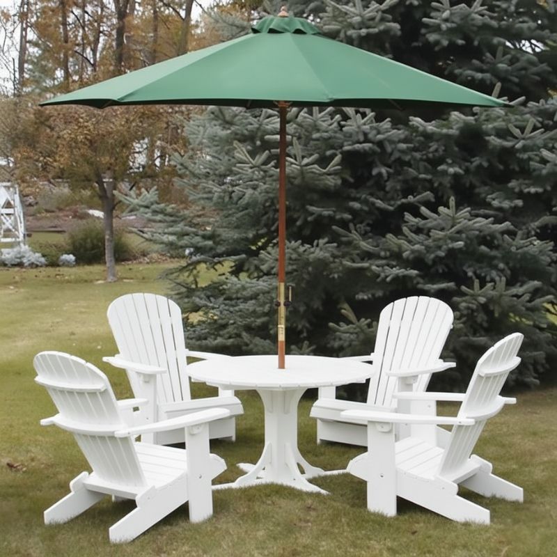 White Royal Picnic Set for 4 with a green umbrella on a grassy area with trees in the background