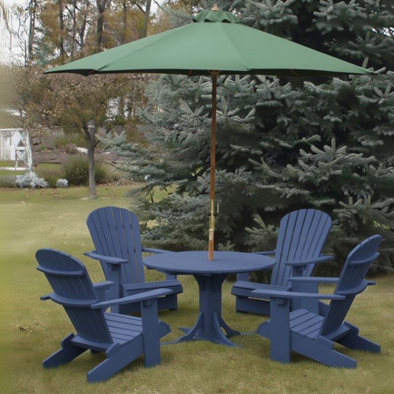 Blue Royal Picnic Set for 4 with a green umbrella on a grassy area with trees in the background.