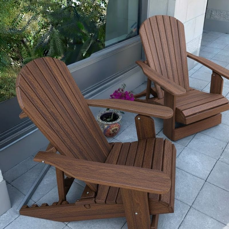 Two Royal Reclining Adirondack Chair (Large) on a patio with a small table and plant - ploy luxe - woodgrain brazilian walnut