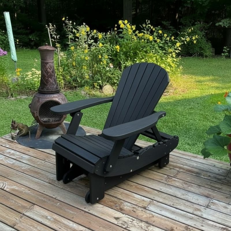 Royal Reclining Glider on a wooden deck with a garden background - poly luxe - black