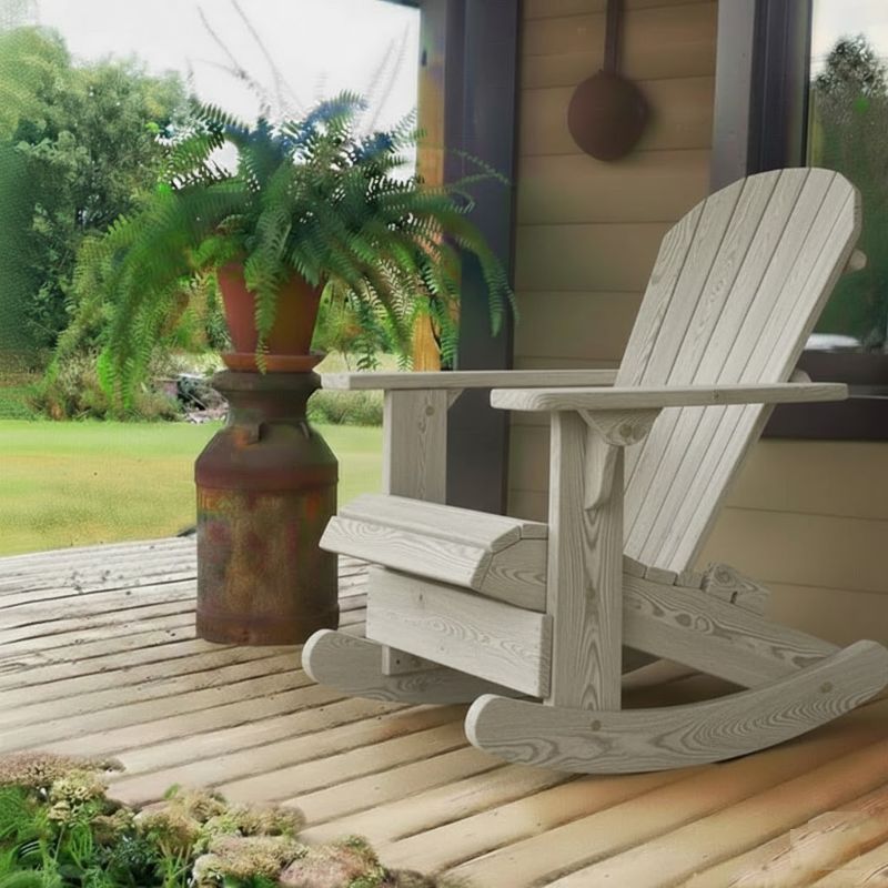 Royal Rocking Adirondack Chair (Large) on a porch with a potted plant and garden view - poly luxe - woodgrain driftwood - grey