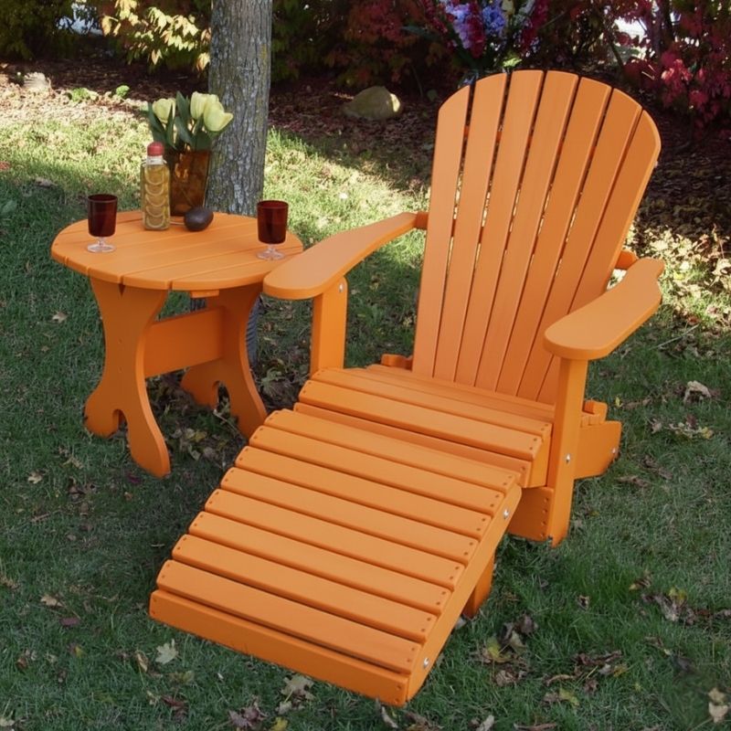 Orange Royal Single Patio Set on a grassy area with flowers in the background