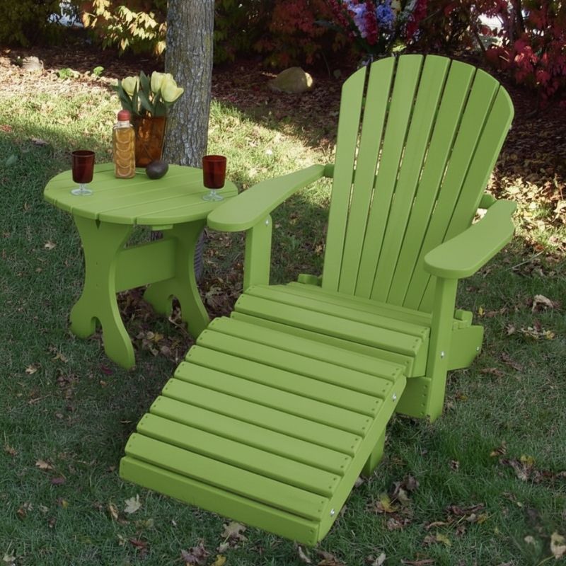 Lime green Royal Single Patio Set set on grass with decorative items.