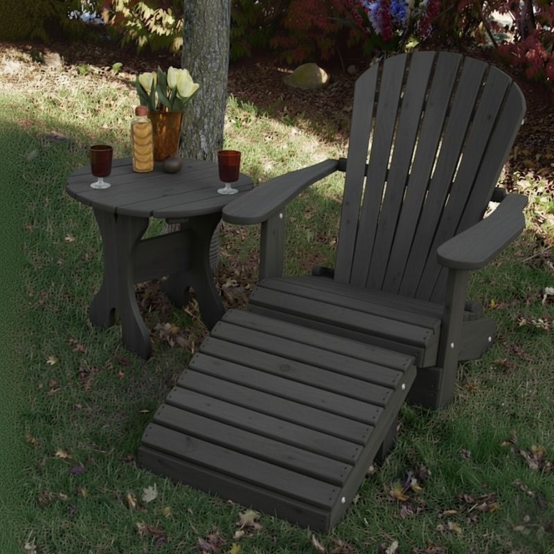 Dark grey Royal Single Patio Set set on a grassy area with flowers and candles.