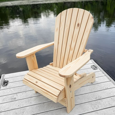 Wooden Adirondack chair on a dock by a body of water