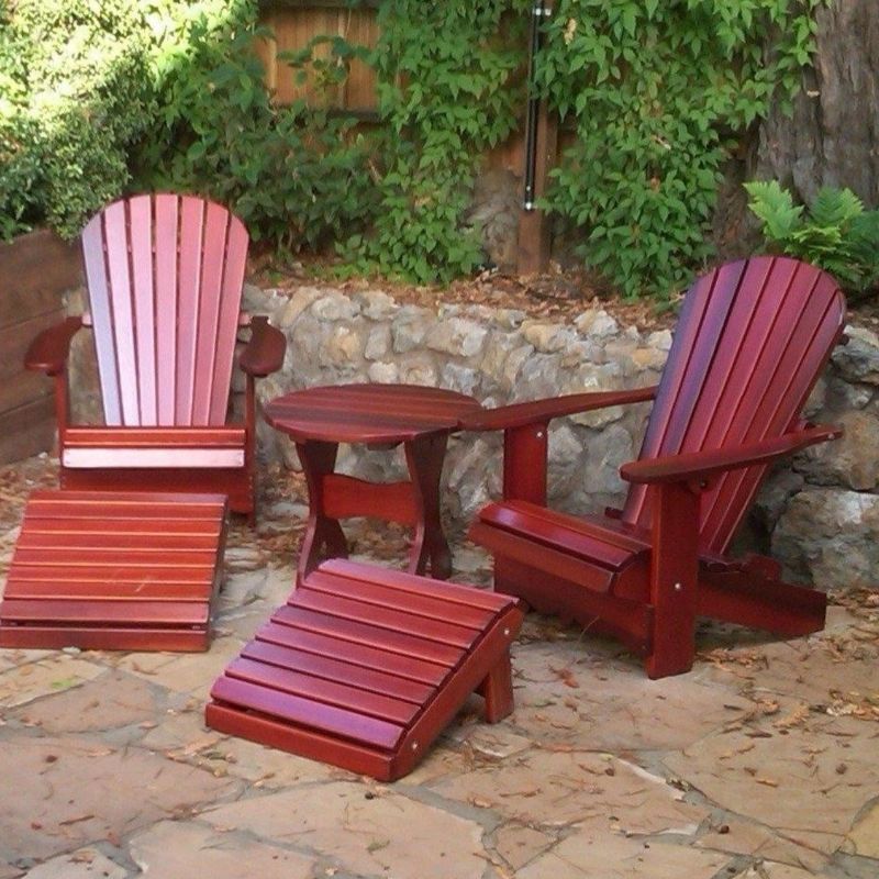 Royal Complete Patio Set on a stone patio with greenery in the background