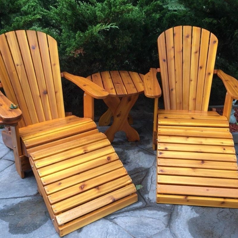 Royal Complete Patio Set chairs with a small table on a stone patio.