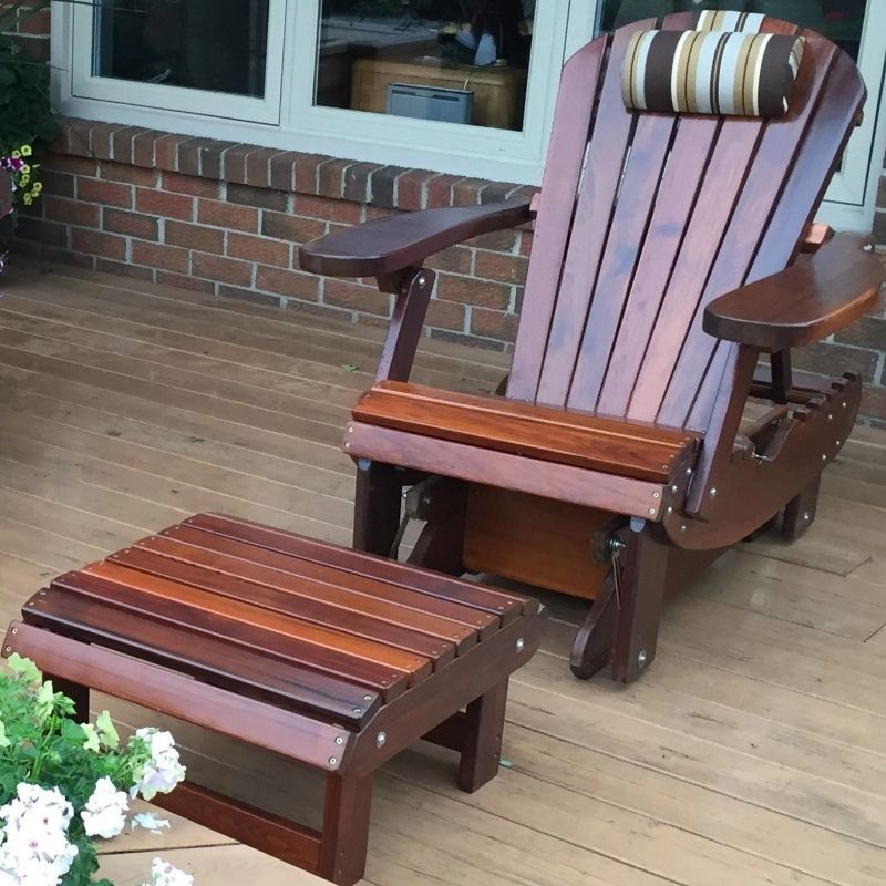 Royal Reclining Glider with ottoman on a wooden deck.