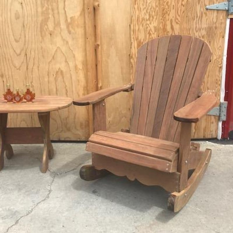 Royal Rocking Adirondack Chair (Large) in front of a wooden wall