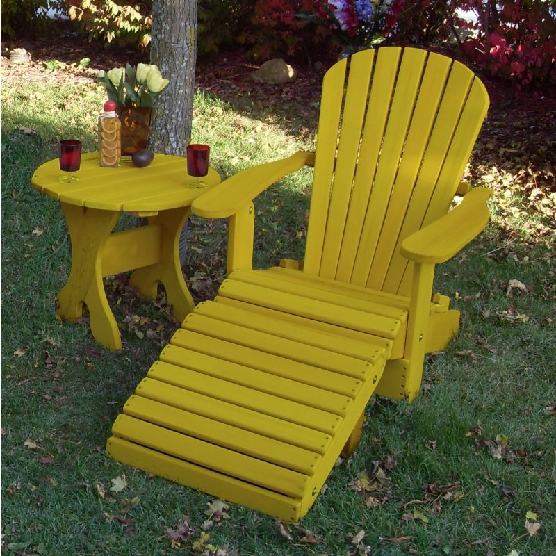 Yellow Royal Single Patio Set on a grassy area with trees and plants in the background.
