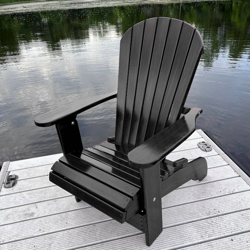 Black Royal Upright Adirondack Chair, on a wooden dock by a body of water