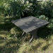 24" Square Side Table in a natural outdoor setting with greenery - clear cedar - golden glossy in a natural setting with greenery - poly luxe - dark grey