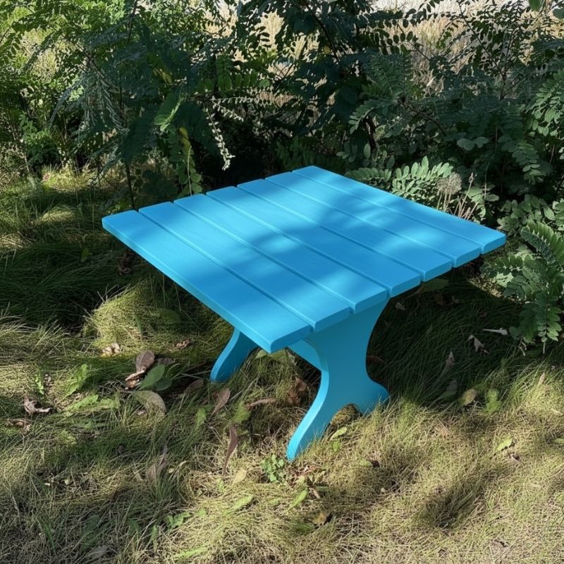 24" Square Side Table in a natural outdoor setting with greenery - clear cedar - golden glossy in a natural setting with greenery - poly luxe - aruba blue