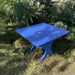 24" Square Side Table in a natural outdoor setting with greenery - clear cedar - golden glossy in a natural setting with greenery - poly luxe - blue