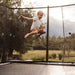 Boy jumping on a ACON 16 HDtrampoline.