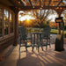 Outdoor setting of Turf Green Bistro Set Comfort Bundle on a deck during sunset.