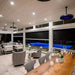 Modern indoor setting installed on ceiling, blue light pool on the background