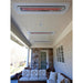 Outdoor patio with ceiling-mounted heaters and a couch.