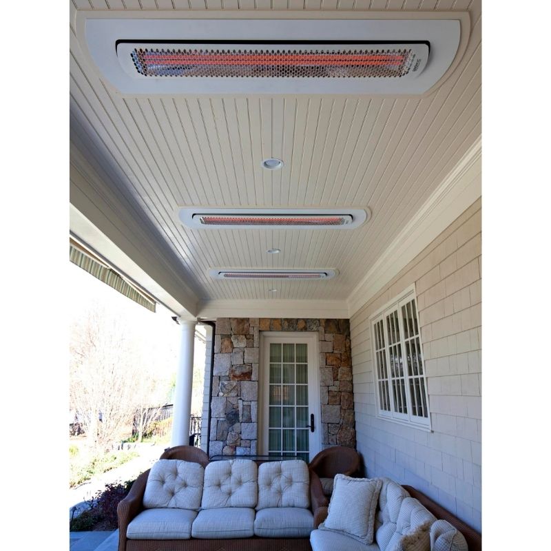 Outdoor patio with ceiling-mounted heaters and a couch.
