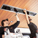 Two guys cleaning the readiant heater